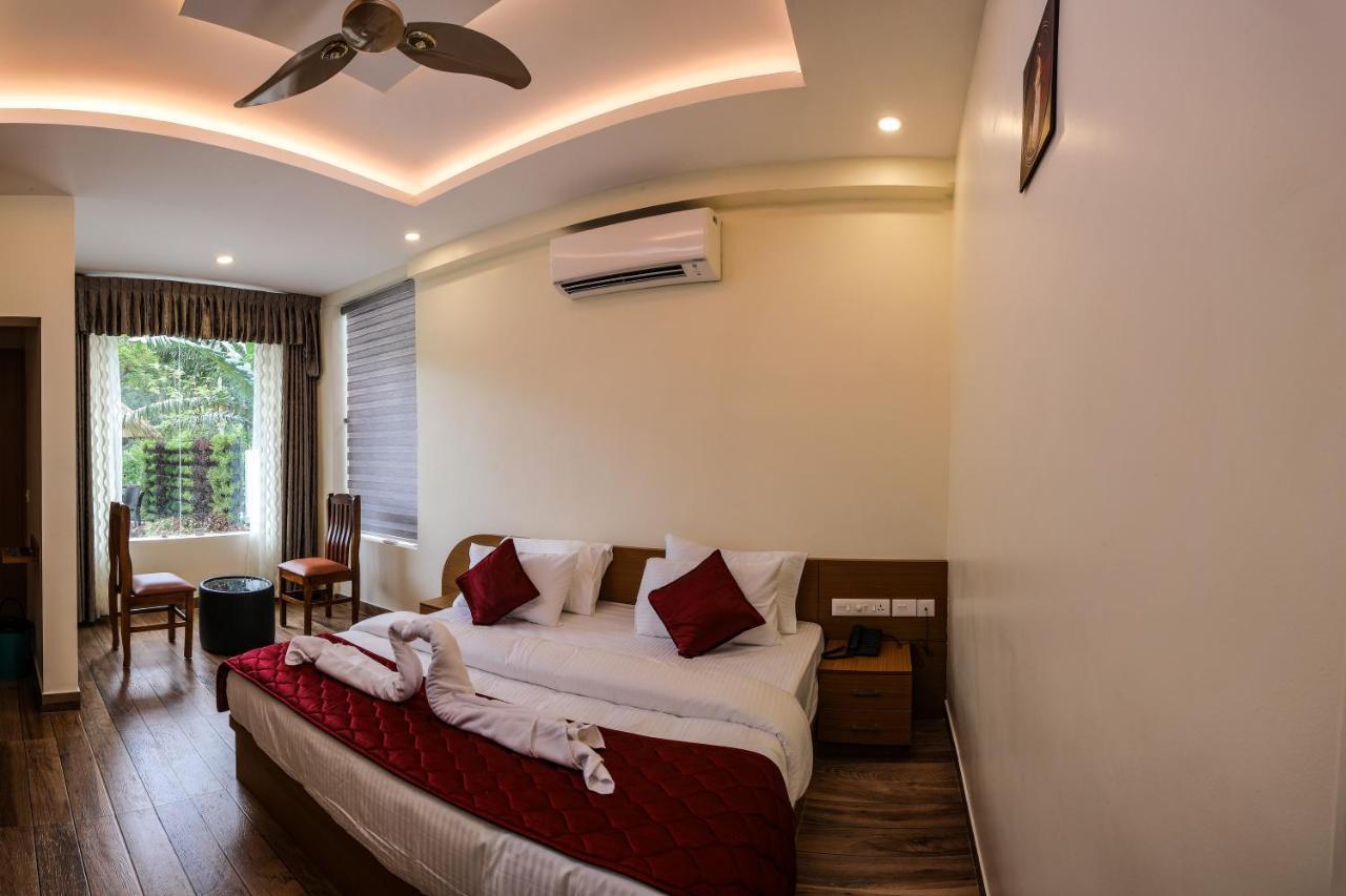 Thenmala Hormuz Inn Kolattupuzha Bagian luar foto